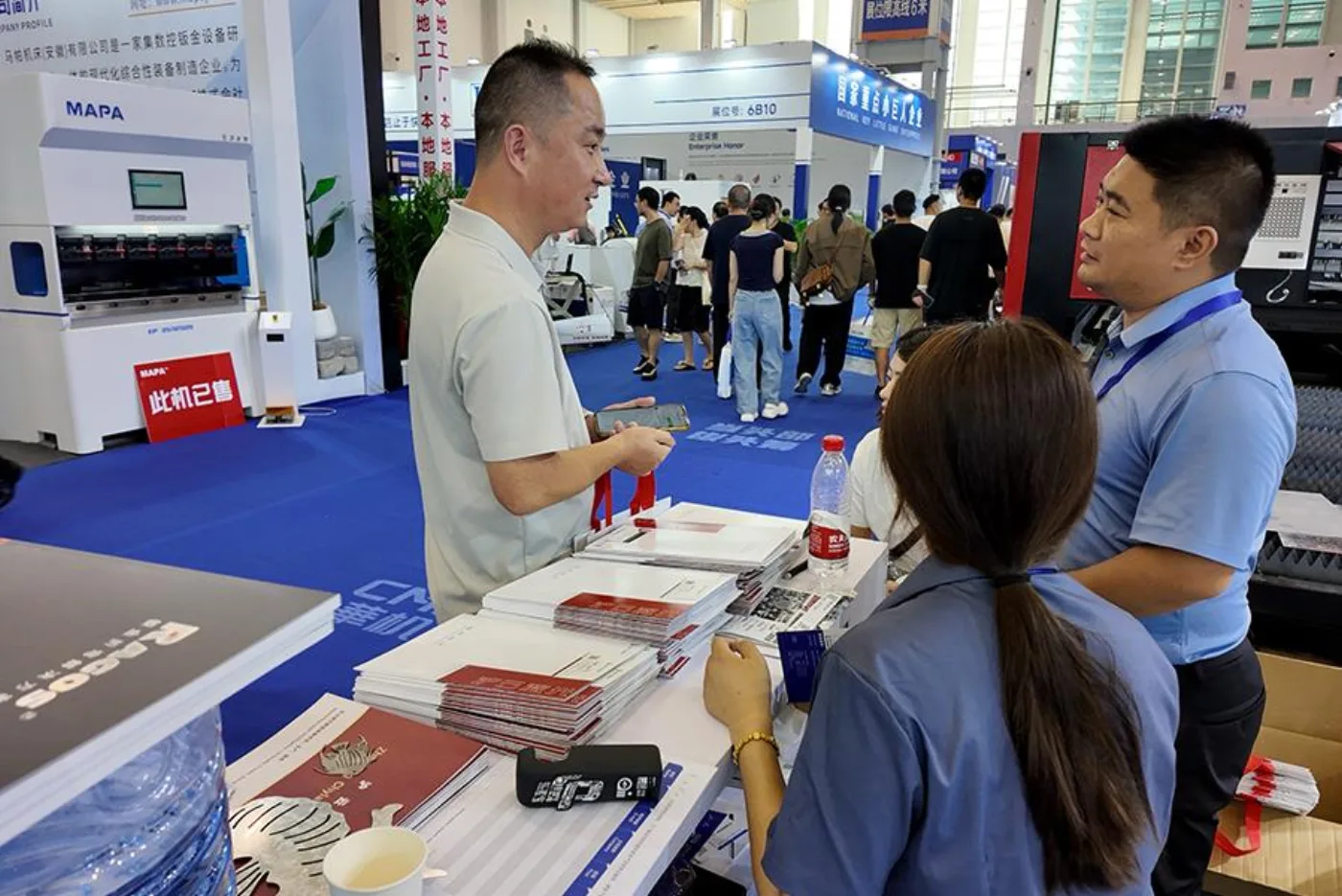 Visitors gather at the CHYLASER booth.